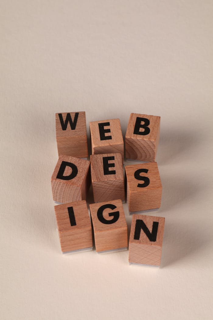 Wooden blocks arranged to spell Web Design. Perfect for creative, digital content themes.
